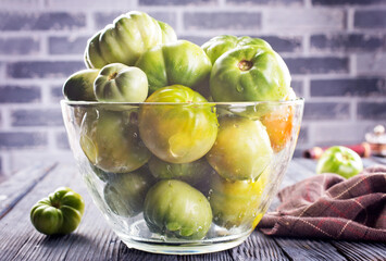 green tomatoes in glass bowl