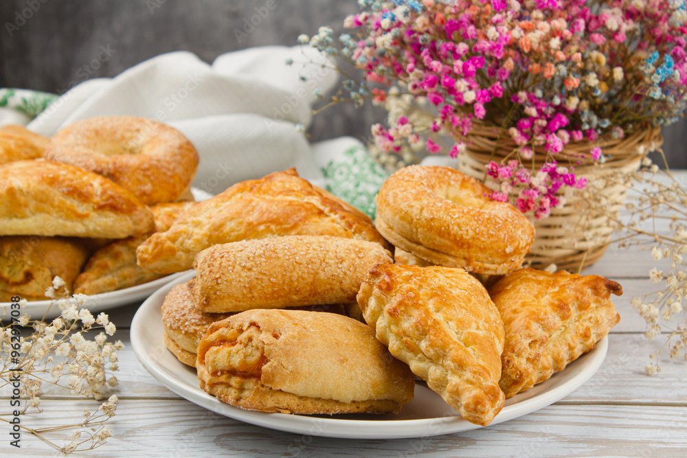 Sticker Plate with homemade pastries on a light table. Sweet breakfast