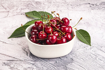 Red sweet cherry in the bowl