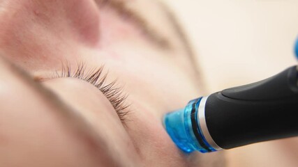 A man undergoes a hydrofacial treatment at a beauty clinic. This advanced procedure rejuvenates and revitalizes the skin, ideal for showcasing premium skincare services in your advertising.