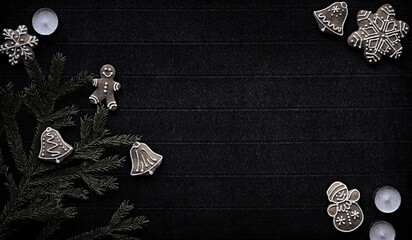 Gingerbread and Christmas tree branches on a dark paper craft background. Happy New Year Banner