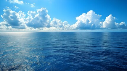Obraz premium ocean water with blue sky and clouds
