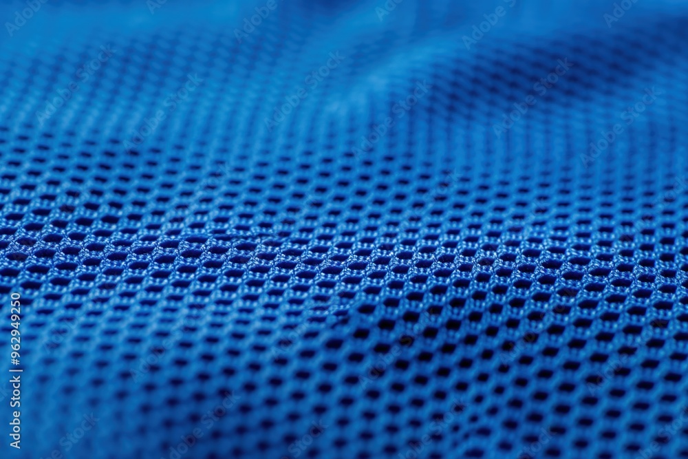 Poster Blue fabric close-up shows grid pattern with small holes creating order and symmetry. Smooth texture gives shiny appearance. Perfect for tech, eco, or fashion designs.