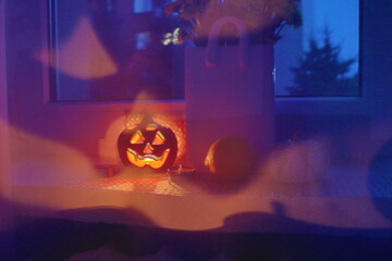 Halloween, pumpkin candle holder with blurred background