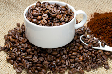 Fototapeta premium some coffee beans and a cup of coffee