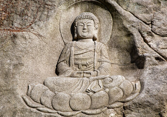 Eunpyeong-gu, Seoul, South Korea - February 18, 2021: Rock Cliff Buddha at Jingwansa Temple