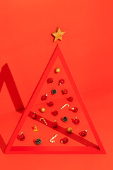 Conceptual Christmas tree on red background