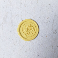 wax stamp coin on ;ight background. sealing wax for wedding invitation or letter for a vintage look