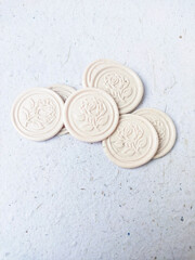 wax stamp coin on ;ight background. sealing wax for wedding invitation or letter for a vintage look