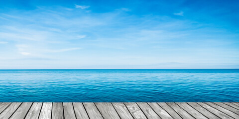Obraz premium Wooden Deck Overlooking Calm Sea – Water and Horizon Texture Background
