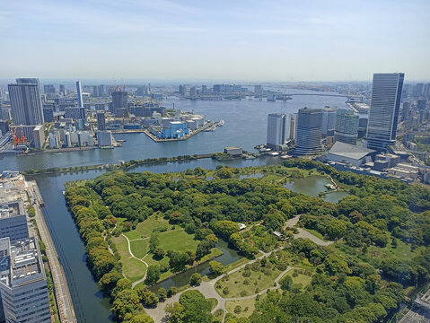 A view of Tokyo Bay and Hamarikyu Gardens from Caretta Shiodome in Tokyo, Japan