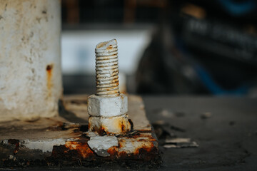 close up rusty screw nuts and bolts on light poles. close up photo. selective focus photo