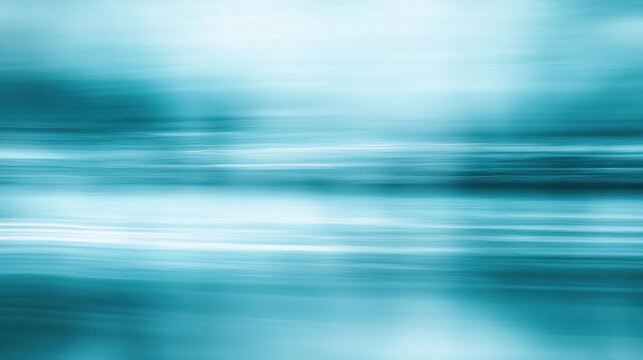 Defocused motion blur in shades of teal and light blue, creating a calming and serene horizontal abstract background.