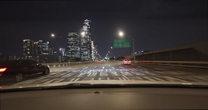 Car drive on Seoul city streets at night