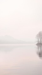 Fototapeta premium Calm lake with misty trees at dawn