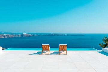 Fototapeta premium Relaxing view from a poolside terrace overlooking a serene blue ocean and distant island.