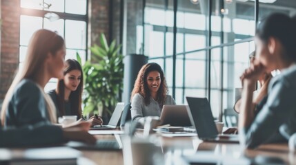 Modern Office Meeting: Business People Collaborate on Laptop