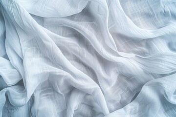 Obraz premium Close-up view of white fabric with subtle texture, folded to intricate design. Fabric dominates gray background, creating serene atmosphere for fashion and lifestyle.