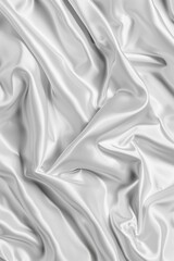 Obraz premium Close-up view of white fabric with subtle texture and gray stripe. Fabric appears wrinkled, adding depth to scene. Perfect for fashion, textile, or design projects.