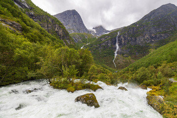 Volefossen waterfall and surrounding mountains in Jostedalsbreen National park, Norway