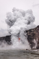 Lava tube flowing into ocean in Hawaii at dawn