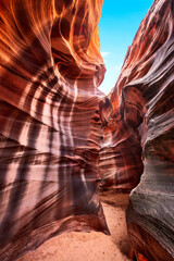 Cardiac Slot Canyon slot opening in Arizona shows beautiful rock patterns and the erosion flash floods can cause over thousands of years.