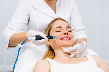 A dermatologist performs a hydro peel facial, highlighting advanced skin therapy for rejuvenation....