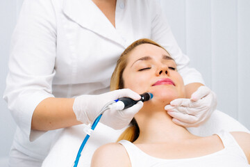 A dermatologist performs a hydro peel facial, highlighting advanced skin therapy for rejuvenation....