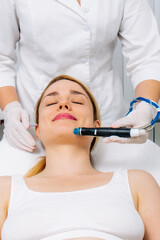 Relaxing beauty treatment in a modern cosmetic clinic. Woman enjoying a hydrolifting procedure, achieving radiant and youthful skin. Perfect for showcasing advanced skincare solutions.