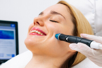 A dermatologist performs a hydro peel facial, highlighting advanced skin therapy for rejuvenation....