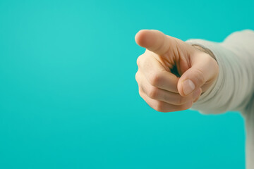 A hand extends outward, pointing confidently towards the viewer