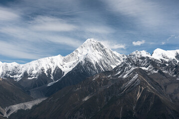 Fototapeta premium Minya Konka (Mount Gongga, Tibetan Snow Mountain) - in Sichuan Province, China. View from the west at Zimei Mountain Pass. Highest Mountain in Sichuan Province China.