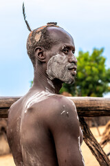 Ethiopia, man from the Karo tribe with typical head decoration and face paintings in his village in the  Omo Valley. 21 th of february 2024