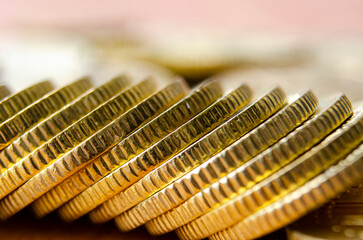Fototapeta premium Close up view of golden coins suitable for any business concept or banking