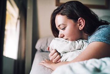 Woman, depression and wake up with mental health, anxiety and fear for calm, relax and tired....