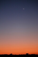 Sunset including the moon in South Africa 