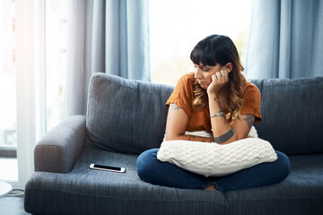 Breakup, depression or sad woman waiting for call for relationship stress or anxiety on couch....