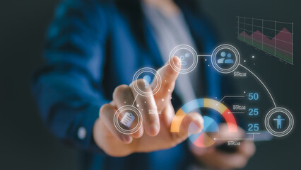 A businessman’s hand pushing a button on a touch screen interface, symbolizing technology and digital connection