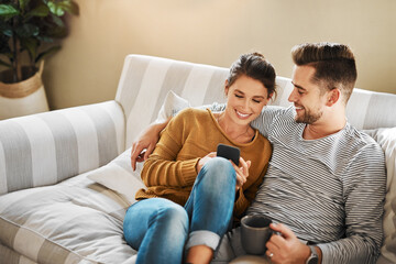 Sofa, couple and relax with smartphone for joke, conversation and bonding together with connection. Happy people, man and woman with cellphone for mobile app, social media and online meme at home