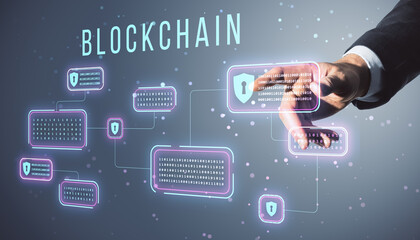 Hand interacting with blockchain hologram on a digital interface, highlighting data security...