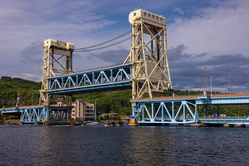 A Raised Double Deck Lift Bridge with Boats Passing Underneath