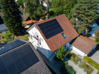 Solar panels on the roof top of private buildings in Germany on a summer day
