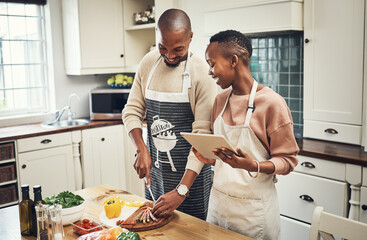 Kitchen, cooking and couple with tablet, online and bonding with healthy food, digital and tips....