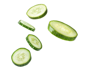 Fresh cucumber slices in air isolated over transparent background, png ready cut-out