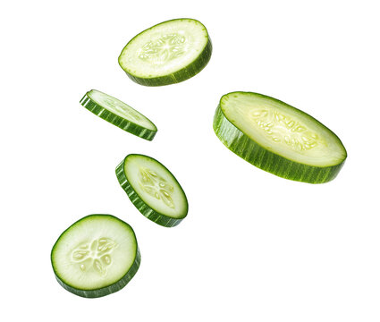 Fresh cucumber slices in air isolated over transparent background, png ready cut-out