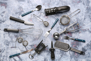 Different kitchen utensils on blue background