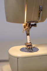 Sewing machine with needle close up. Home sewing machine. Sewing as a hobby. 