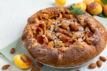 Open pie (galette) with apricots and almonds.
