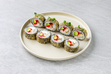 Japanese sushi tempura maki crab meat and tobiko roll on slate. Japanese traditional fusion food style, restaurant menu