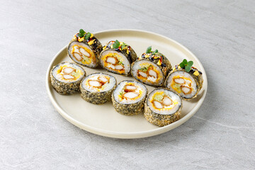 Japanese sushi tempura maki crab meat and tobiko roll on slate. Japanese traditional fusion food style, restaurant menu